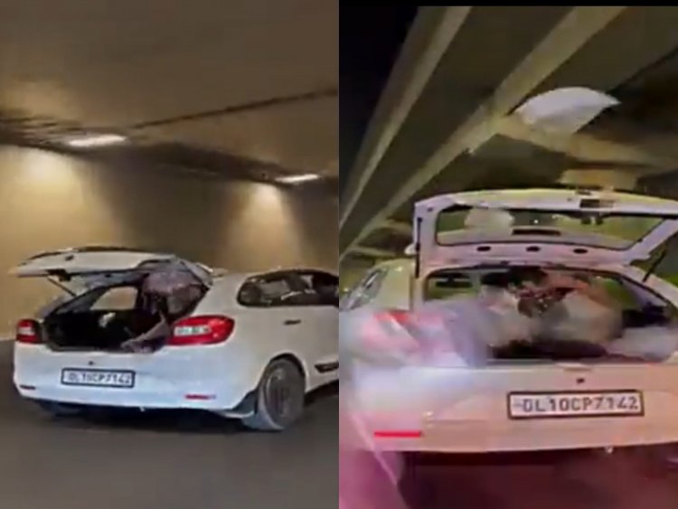Gurugram: नकाबपोश ने चलती कार की डिक्की से रोड पर बरसाये नोट, video viral